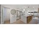 Bright kitchen with island seating, sleek appliances, open shelving, and hardwood floors for a stylish culinary experience at 4411 N 40Th St # 40, Phoenix, AZ 85018