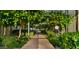 Pathway through lush landscaping with mature trees and manicured greenery at 4411 N 40Th St # 40, Phoenix, AZ 85018