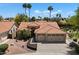 Beautiful desert home featuring a tile roof, three-car garage, and professional desert landscaping at 4625 E Villa Maria Dr, Phoenix, AZ 85032