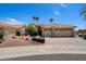 Charming single-story home featuring desert landscaping, palm trees, and a three-car garage at 4625 E Villa Maria Dr, Phoenix, AZ 85032