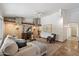 Comfortable living room with stone and wood beam accents, plush seating, and neutral tones offering a serene and inviting space at 4625 E Villa Maria Dr, Phoenix, AZ 85032