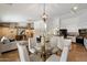 Inviting living space with stylish stone accents, comfortable seating, and seamless access to the kitchen and dining areas at 4625 E Villa Maria Dr, Phoenix, AZ 85032