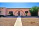 Charming home with unique arched entrance and low-maintenance desert landscaping at 4625 W Thomas Rd # 71, Phoenix, AZ 85031