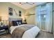 Cozy bedroom features modern decor, soft lighting, and comfortable furnishings at 4698 E French Rd, San Tan Valley, AZ 85143