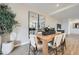 Dining area featuring a wooden table, six chairs, and stylish decor at 4698 E French Rd, San Tan Valley, AZ 85143