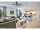 Open-concept living room and kitchen with modern finishes and ample seating at 4698 E French Rd, San Tan Valley, AZ 85143