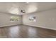 Spacious bedroom with a ceiling fan, neutral color palette, and natural light at 4913 E Acoma Dr, Scottsdale, AZ 85254