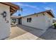 Inviting home exterior showcases attractive landscaping and a decorative water fountain at 4913 E Acoma Dr, Scottsdale, AZ 85254