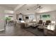 Spacious living room features modern ceiling fan, wood flooring and lots of natural light at 4913 E Acoma Dr, Scottsdale, AZ 85254