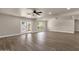 Bright and spacious living room features modern fan and access to the backyard at 4913 E Acoma Dr, Scottsdale, AZ 85254