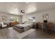 Serene main bedroom with neutral tones, a ceiling fan, and plenty of natural light at 4913 E Acoma Dr, Scottsdale, AZ 85254