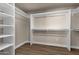 Walk-in closet with ample shelving and hanging space at 4913 E Acoma Dr, Scottsdale, AZ 85254