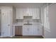 Kitchenette space features stainless steel appliances and white shaker cabinets at 5336 W Lewis Ave, Phoenix, AZ 85035