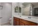 Bathroom with double sink vanity, modern faucets, and decorative mirrors at 5621 S 30Th Gln, Phoenix, AZ 85041