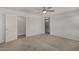 Bright bedroom features plush carpet and ensuite bathroom at 5621 S 30Th Gln, Phoenix, AZ 85041