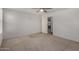 Spacious bedroom featuring neutral carpet, ceiling fan, and natural lighting at 5621 S 30Th Gln, Phoenix, AZ 85041