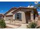 Inviting exterior view of a home with desert landscaping, a covered porch, and a tile roof at 5621 S 30Th Gln, Phoenix, AZ 85041