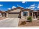 Charming single-story home featuring a desert landscape, tile roof, and an attached two-car garage at 5621 S 30Th Gln, Phoenix, AZ 85041