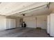 The spacious garage features storage cabinets and a door to the backyard at 5621 S 30Th Gln, Phoenix, AZ 85041