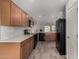 Bright kitchen with wood cabinets, white quartz countertops, and modern appliances at 5621 S 30Th Gln, Phoenix, AZ 85041