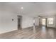 Bright, open-concept living area featuring stylish tile flooring and sliding glass doors to the backyard at 5621 S 30Th Gln, Phoenix, AZ 85041
