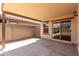 This outdoor patio features a concrete floor and access to the backyard at 5621 S 30Th Gln, Phoenix, AZ 85041