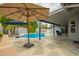 Backyard oasis with covered patio, pool, pavers, lounge chairs and shade at 620 W Crofton St, Chandler, AZ 85225