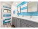 Bright bathroom with blue striped tile, dual sinks, gray cabinets and new fixtures at 620 W Crofton St, Chandler, AZ 85225
