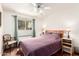 Bedroom with wood floors, ceiling fan, natural light and neutral paint at 620 W Crofton St, Chandler, AZ 85225