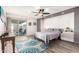 Serene main bedroom with a ceiling fan, sliding glass doors to the patio, and custom built-in storage at 620 W Crofton St, Chandler, AZ 85225