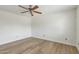 Empty room featuring hardwood floors, neutral paint and a ceiling fan at 638 W Pantera Ave, Mesa, AZ 85210