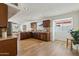 Bright and open kitchen featuring modern appliances, wood cabinets, and luxury vinyl plank flooring at 638 W Pantera Ave, Mesa, AZ 85210