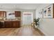 Bright kitchen featuring modern appliances, wood cabinets, and luxury vinyl plank flooring at 638 W Pantera Ave, Mesa, AZ 85210