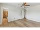 Open main bedroom with walk-in closet and ensuite bathroom featuring tiled shower/tub at 638 W Pantera Ave, Mesa, AZ 85210
