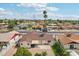 Home's backyard with grass lawn, open patio, gravel landscaping, and block wall fencing at 638 W Pantera Ave, Mesa, AZ 85210