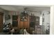Cozy living room with a large display cabinet, comfortable chair, and a ceiling fan at 6725 W Colter St, Glendale, AZ 85303