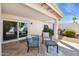 A cozy covered patio with cushioned seating and decorative tile rug offer a relaxing outdoor living space at 7214 N Via De La Siesta --, Scottsdale, AZ 85258