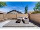 Backyard featuring outdoor seating, a brick patio, brick wall, and string lights at 7634 W Redbird Rd, Peoria, AZ 85383