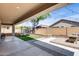 Spacious backyard featuring lounge seating, string lights, artificial grass, and a trampoline at 7634 W Redbird Rd, Peoria, AZ 85383