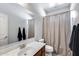 Standard bathroom featuring a single sink vanity, toilet, and shower with neutral finishes at 7634 W Redbird Rd, Peoria, AZ 85383
