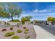 Rock Springs community entrance with stone signage, desert landscaping, and a secure gate at 7634 W Redbird Rd, Peoria, AZ 85383