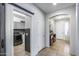 Hallway showing laundry room, front door, and archways at 7634 W Redbird Rd, Peoria, AZ 85383