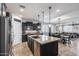 Spacious kitchen featuring granite countertops, stainless steel appliances and open to living room at 7634 W Redbird Rd, Peoria, AZ 85383