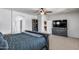 Comfortable main bedroom with king size bed and view to hallway and adjacent bath at 7634 W Redbird Rd, Peoria, AZ 85383