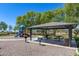 Shaded picnic area in the community park featuring charcoal grills and picnic tables at 7634 W Redbird Rd, Peoria, AZ 85383