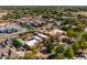 An aerial view showing the home and surrounding neighborhood with tree lined street at 8675 S College Ln, Tempe, AZ 85284