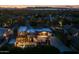 Night aerial shot of home showcasing pool, yard, desert landscaping, and mountain views at 8675 S College Ln, Tempe, AZ 85284