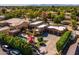 Overhead perspective of home highlighting a luxurious pool area, outdoor seating, and private, manicured grounds at 8675 S College Ln, Tempe, AZ 85284