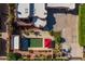Aerial view of a home featuring a backyard pool and a patio area, complemented by lush landscaping at 8675 S College Ln, Tempe, AZ 85284