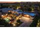 Night aerial shot of home showcasing pool, yard, desert landscaping, and mountain views at 8675 S College Ln, Tempe, AZ 85284